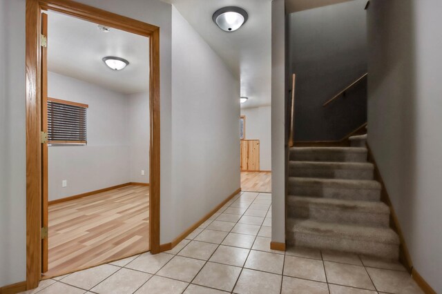 hallway with light tile patterned floors