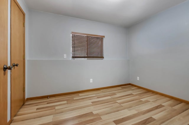 unfurnished room featuring light hardwood / wood-style flooring