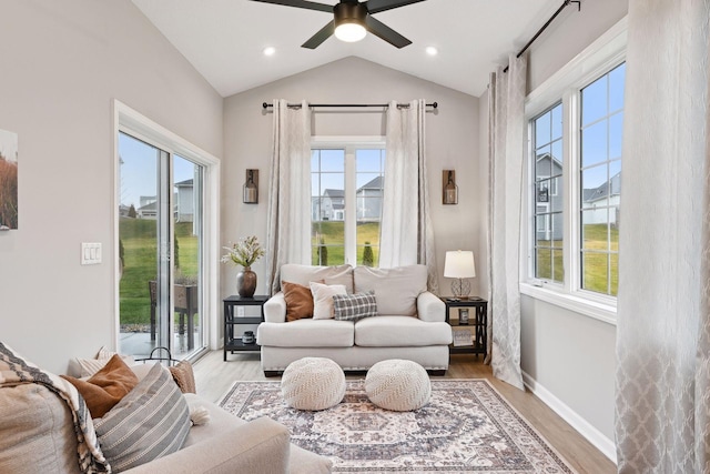 interior space with ceiling fan, plenty of natural light, and lofted ceiling