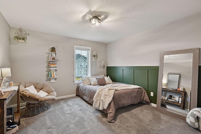 carpeted bedroom featuring a textured ceiling