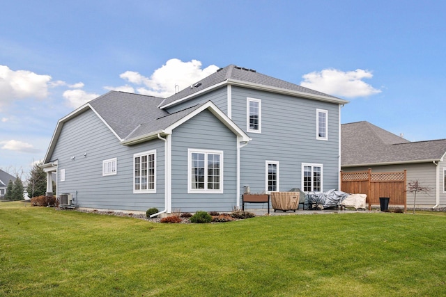 back of property featuring an outdoor living space, cooling unit, and a yard