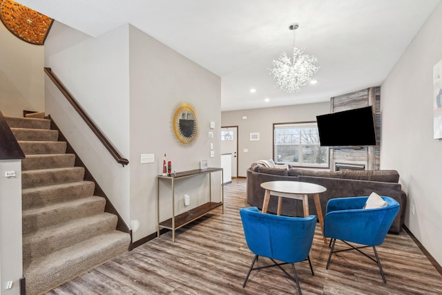 living room featuring a notable chandelier and wood-type flooring