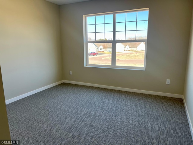 805 Tomahawk Ct, Madison Lake, MN 56063 - spare room featuring dark colored carpet and baseboards