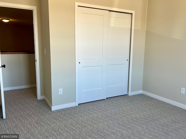 805 Tomahawk Ct, Madison Lake, MN 56063 - unfurnished bedroom with a closet, baseboards, and carpet