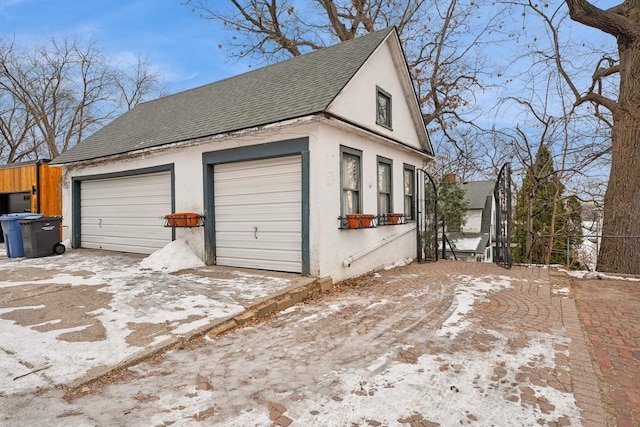 view of snow covered garage