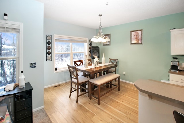 dining area featuring light wood-type flooring