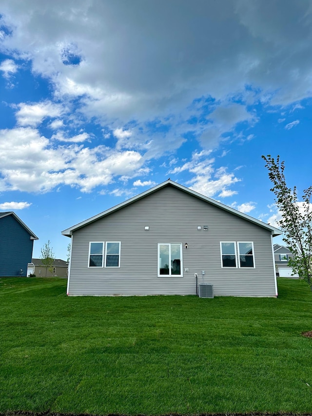 view of side of home featuring a lawn