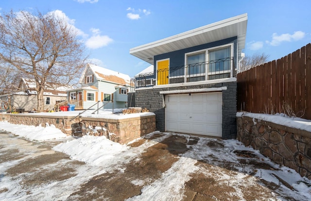 exterior space with a balcony and a garage