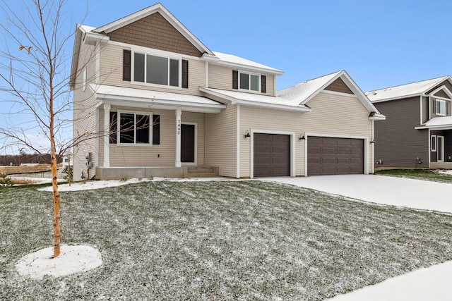 view of front of home with a garage and a front yard