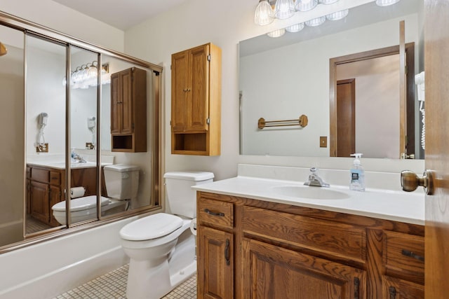 full bathroom featuring shower / bath combination with glass door, tile patterned flooring, vanity, and toilet