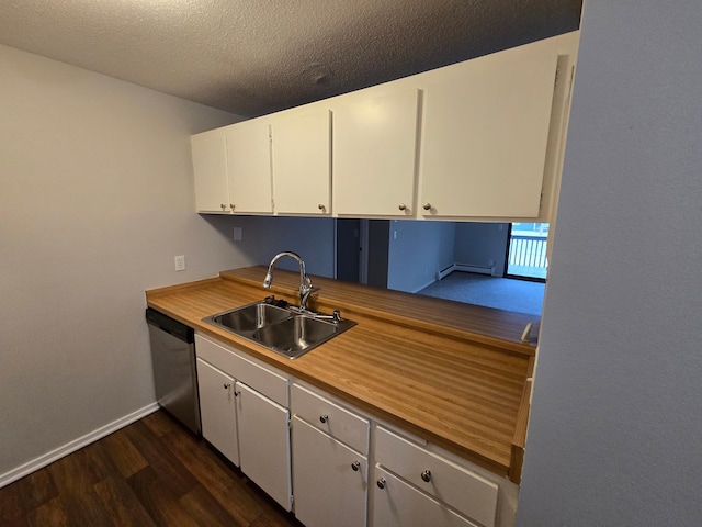 kitchen featuring sink, stainless steel dishwasher, a textured ceiling, dark hardwood / wood-style flooring, and white cabinetry