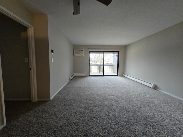 carpeted spare room featuring ceiling fan, an AC wall unit, a textured ceiling, and a baseboard heating unit