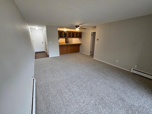 unfurnished living room featuring carpet floors