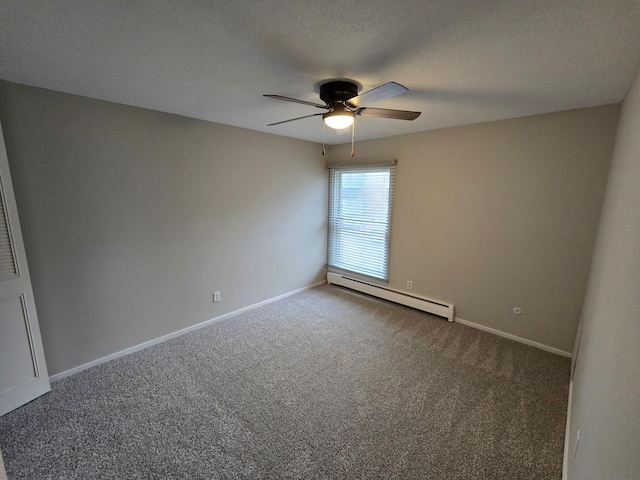 carpeted spare room featuring ceiling fan, a textured ceiling, and a baseboard heating unit