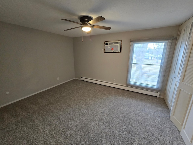 empty room featuring carpet, a wall mounted air conditioner, ceiling fan, and a baseboard heating unit