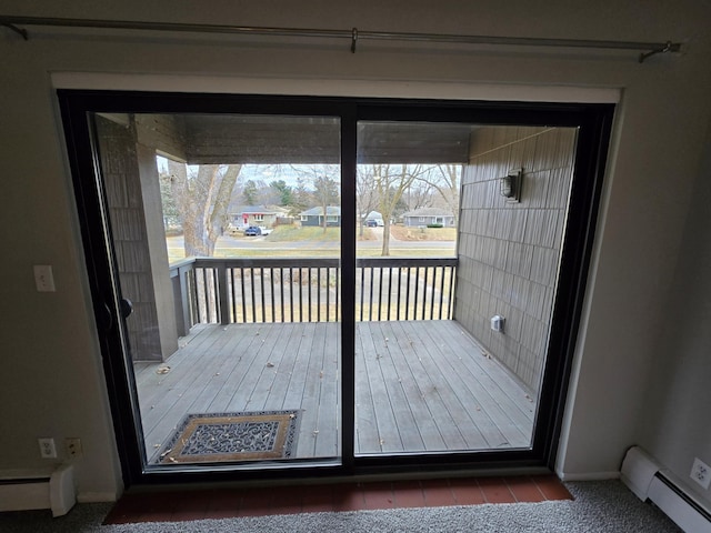 entryway featuring a baseboard heating unit