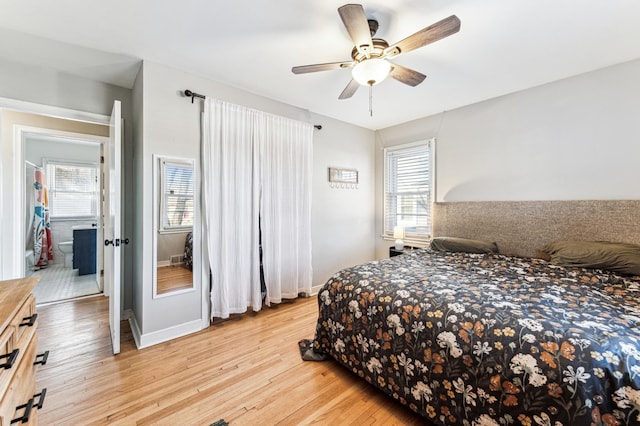 bedroom featuring light wood-type flooring, ensuite bathroom, and ceiling fan