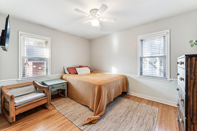 bedroom featuring light wood-type flooring and ceiling fan