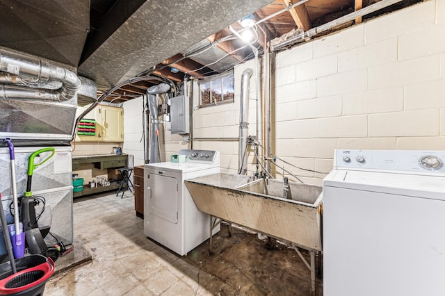 washroom with separate washer and dryer, sink, and electric panel