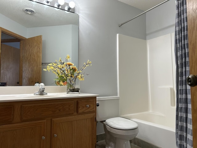 full bathroom featuring vanity, shower / tub combo, a textured ceiling, and toilet