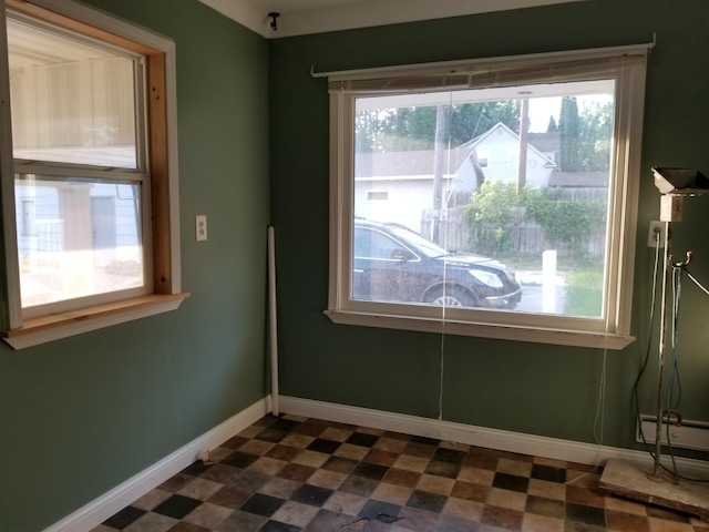 436 6th Ave SW, Cambridge, MN 55008 - unfurnished room with dark floors and baseboards