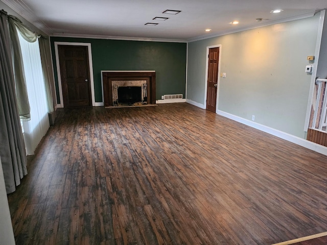 436 6th Ave SW, Cambridge, MN 55008 - unfurnished living room with crown molding, wood finished floors, a fireplace, and recessed lighting