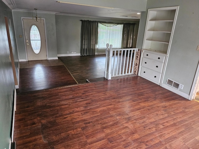 436 6th Ave SW, Cambridge, MN 55008 - empty room with ornamental molding, wood finished floors, and healthy amount of natural light