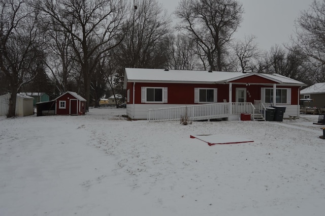 view of front of home with a storage shed