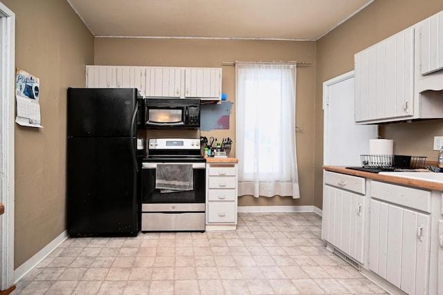 kitchen featuring black appliances and white cabinets