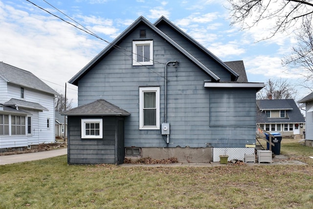 view of side of home featuring a lawn