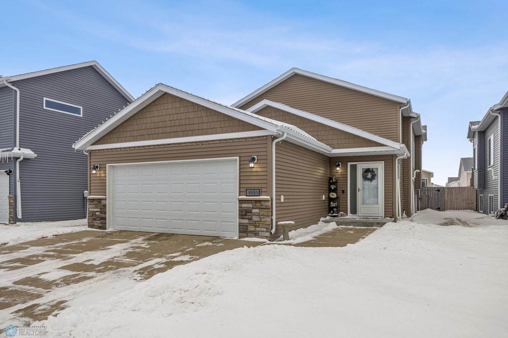 view of front of property with a garage