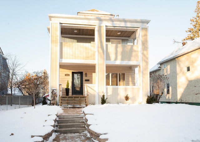 view of front of property with a balcony