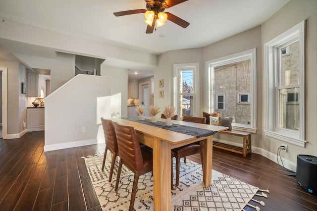 dining area with dark hardwood / wood-style floors and ceiling fan