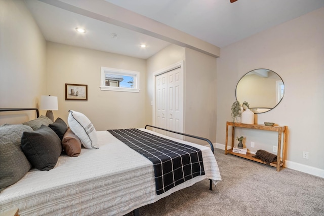 bedroom featuring carpet flooring and a closet