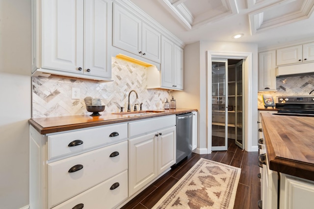 kitchen featuring wooden counters, white cabinets, stainless steel dishwasher, and sink