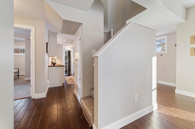 corridor featuring dark hardwood / wood-style floors