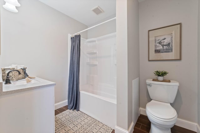 full bathroom featuring hardwood / wood-style floors, vanity, toilet, and shower / tub combo with curtain