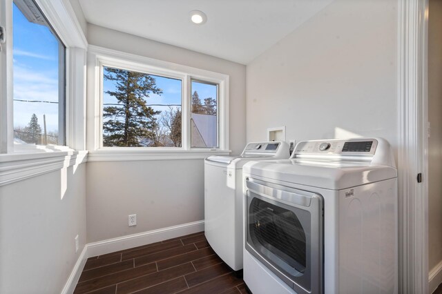 laundry room featuring separate washer and dryer and dark hardwood / wood-style floors