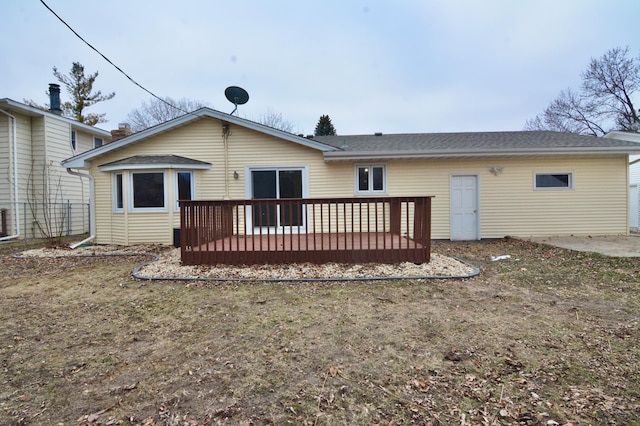 rear view of house with a wooden deck