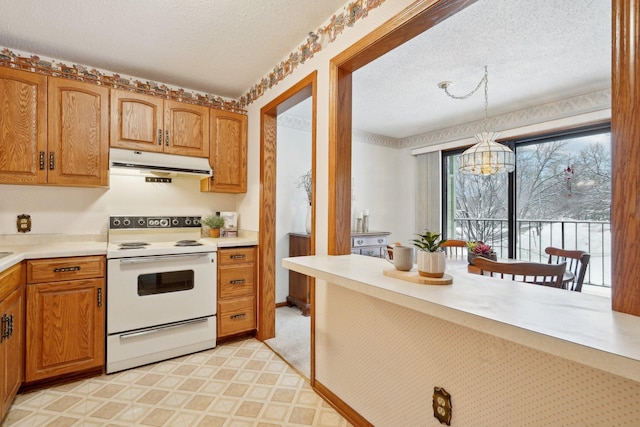 kitchen with electric range, pendant lighting, a textured ceiling, and an inviting chandelier