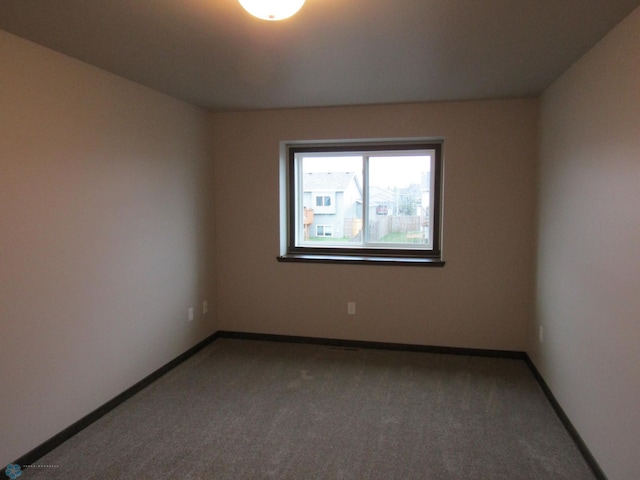 4433 19th St S, Moorhead, MN 56560 - empty room featuring carpet flooring and baseboards