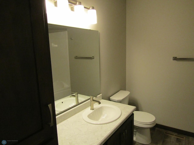 bathroom with vanity and toilet