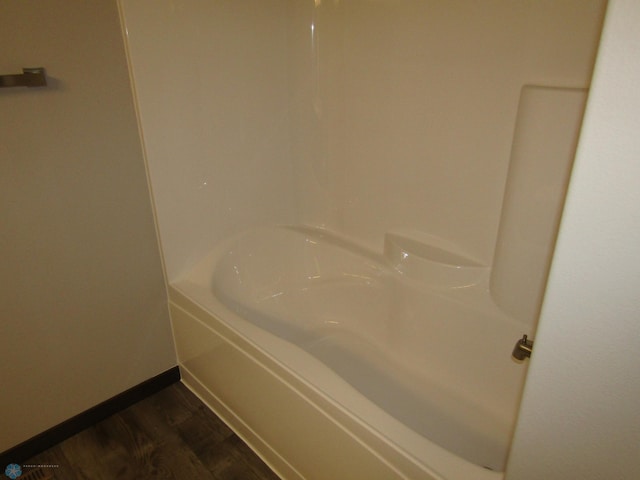 bathroom with hardwood / wood-style flooring