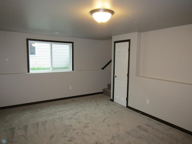 empty room featuring light colored carpet