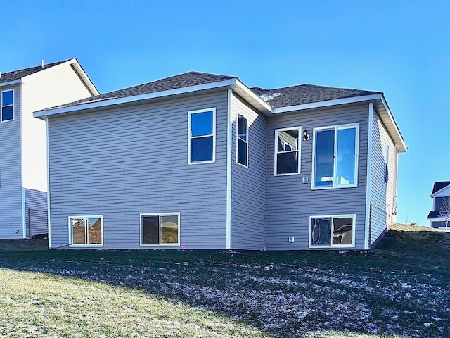 view of side of home featuring a lawn