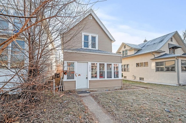 view of front of property featuring a sunroom