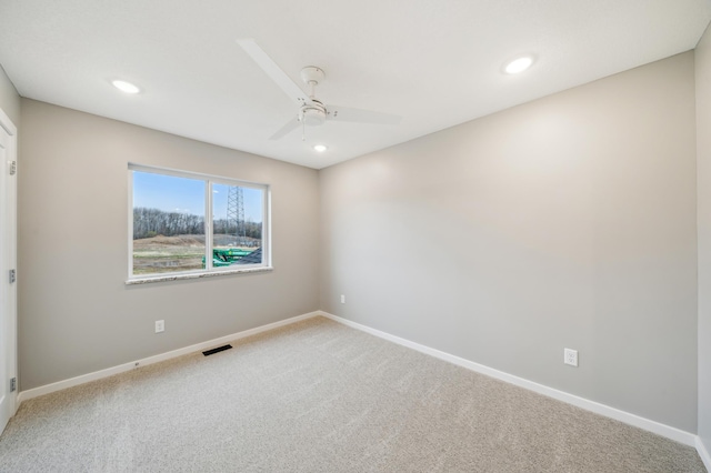 carpeted empty room with recessed lighting, ceiling fan, visible vents, and baseboards