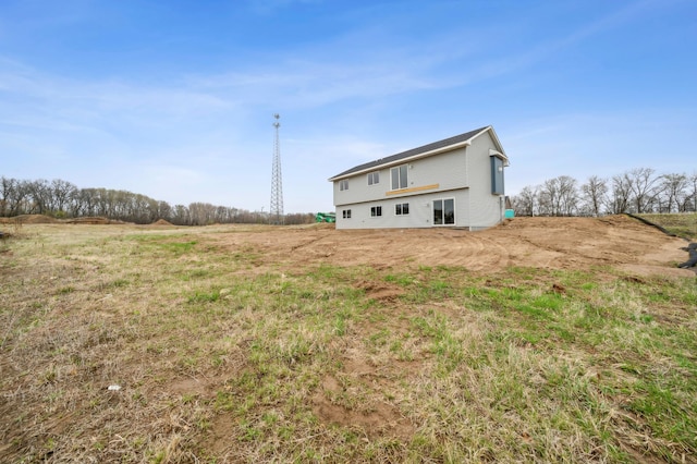 rear view of house with a rural view