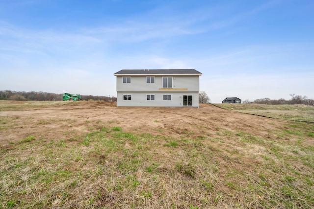 rear view of property with a rural view