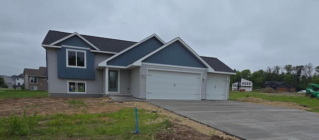 230 Eagle Ridge Dr, Roberts, WI 54023 - view of front facade featuring an attached garage and concrete driveway